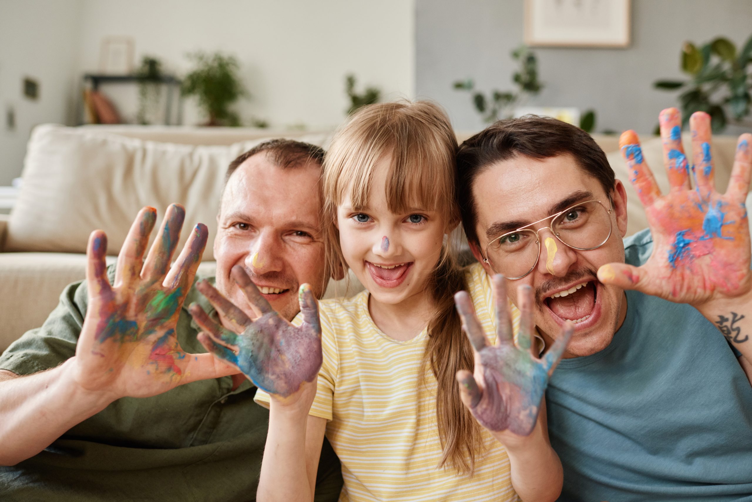 Happy family with child painting at home